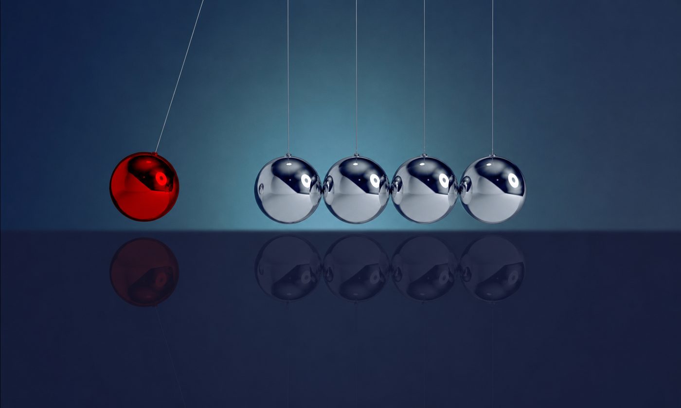 Un pendule de Newton avec une bille rouge en mouvement, symbolisant les stimulations bilatérales du RITMO.